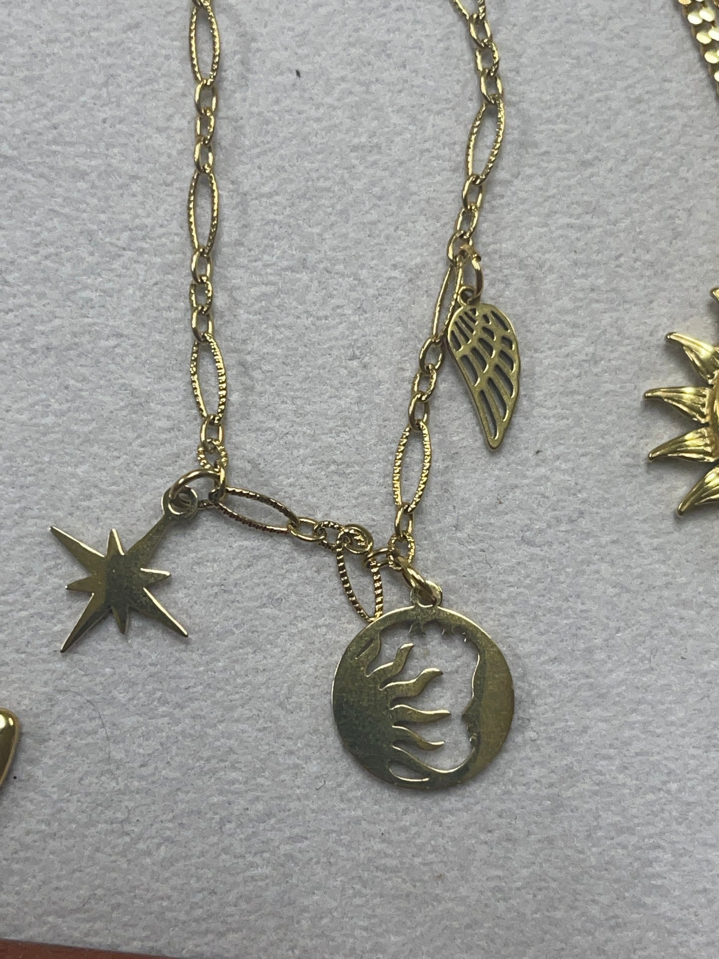 @lovelylittlethings_90 sun moon star wing necklace